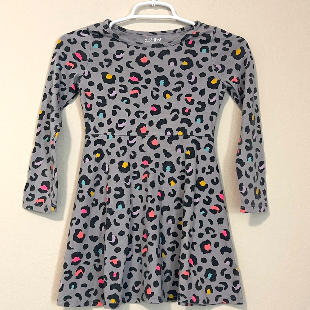 A kids colorful leopard print dress with a grey background